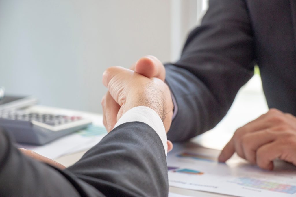 Business hand shaking